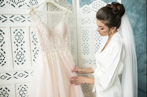 What Are the Risks of Not Dry Cleaning Your Wedding Dress Promptly?